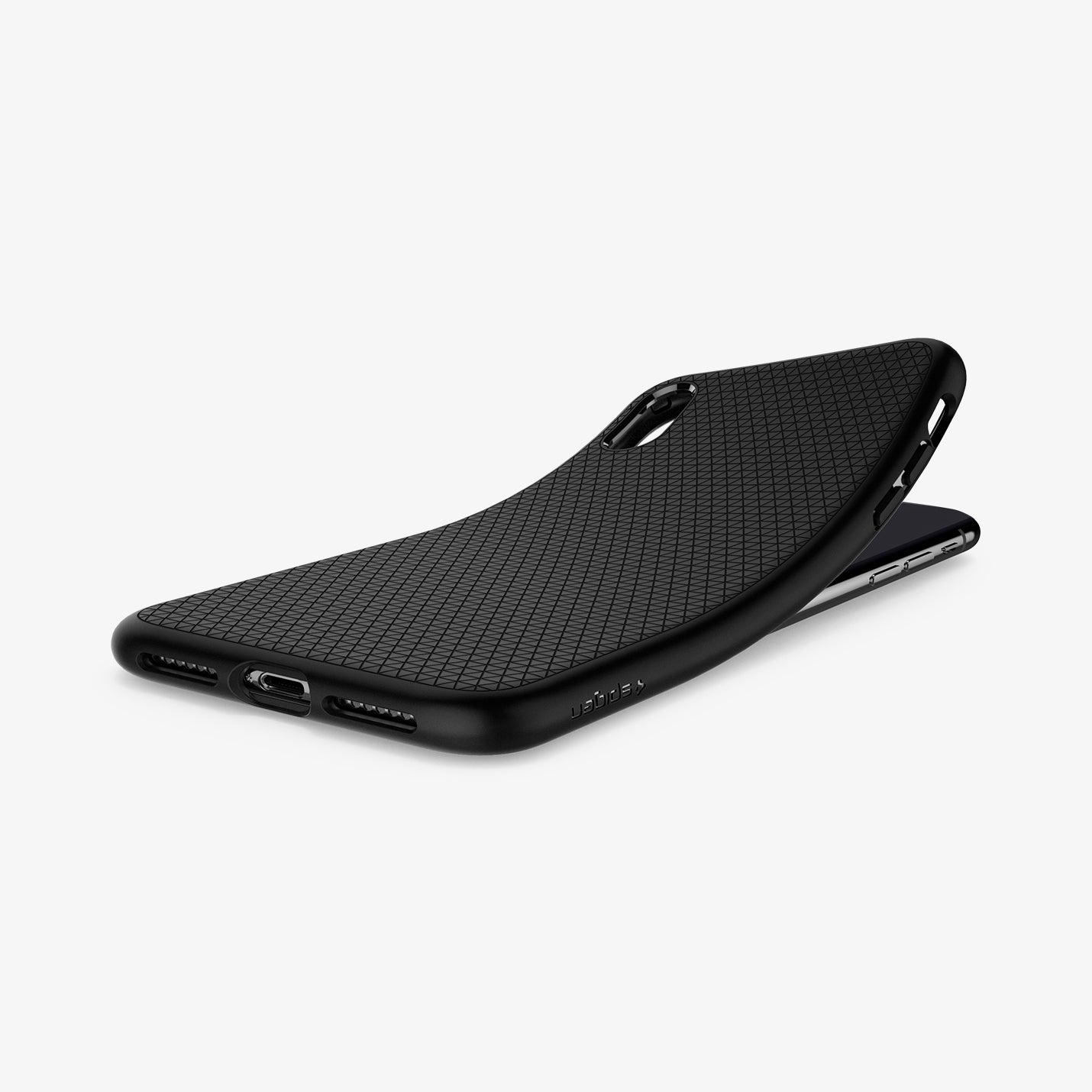 057CS22123  - iPhone XS Case Liquid Air in  Matte Black showing the back, partially peeled from behind a device on a flat surface