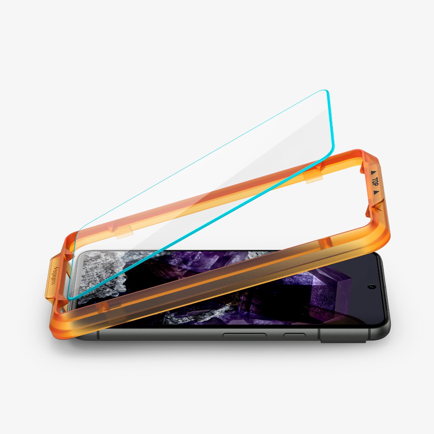 AGL07396 - Pixel 8 Alignmaster in Clear showing the tempered glass partially hovering above the alignment tray and a device